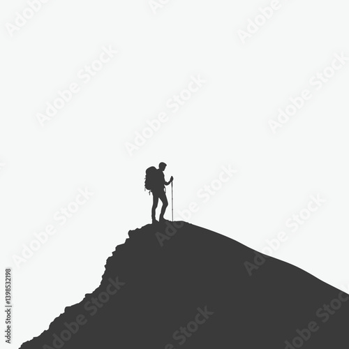 Hiker with backpack standing on mountain peak

