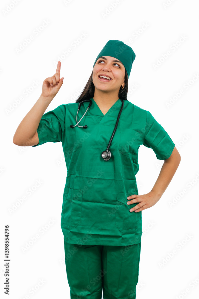 vertical Latin female surgeon pointing and looking up with a smile on white background vertical Latin female surgeon pointing and looking up with a smile on white background