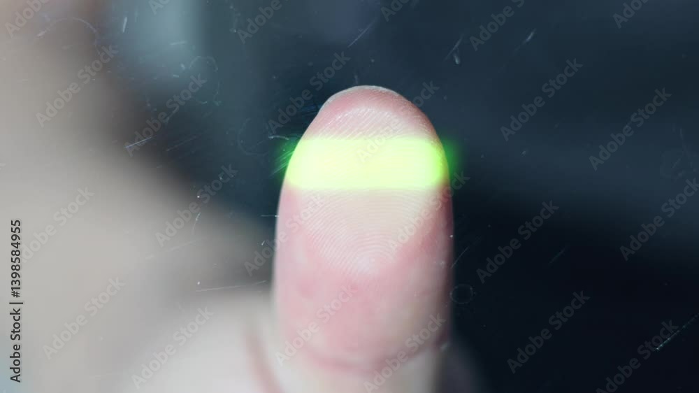 fingerprint scanning. security check. person puts thumb on scanner ...