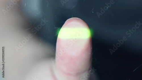 fingerprint scanning. security check. person puts thumb on scanner