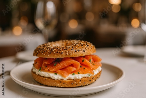 Savory Sesame Bagel Filled With Smoked Salmon and Cream Cheese Served on a Plate