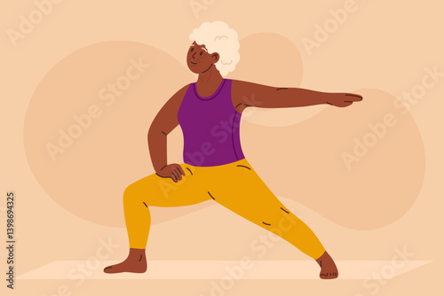Senior woman practicing yoga in warrior pose. Confident elderly person doing fitness exercise on mat. Concept of healthy aging, strength, flexibility, active lifestyle and wellness.