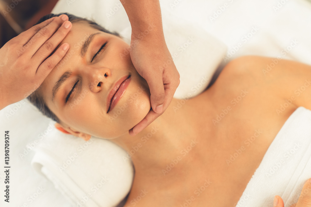 Panorama top view of woman enjoying relaxing anti-stress head massage and pampering facial beauty skin recreation leisure in dayspa modern light ambient at luxury resort or hotel spa salon. Quiescent Panorama top view of woman enjoying relaxing anti-stress head massage and pampering facial beauty skin recreation leisure in dayspa modern light ambient at luxury resort or hotel spa salon. Quiescent