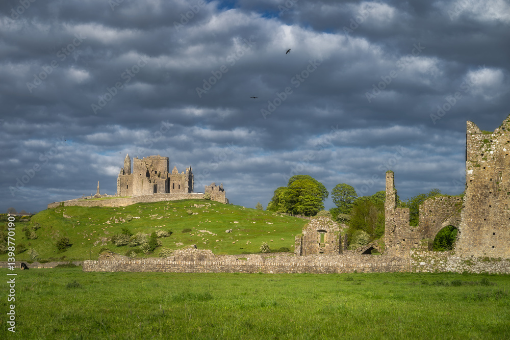 Explore ancient ruins of Rock of Cashel and Hore Abbey nestled within vibrant landscape all under stunning sky that is perfect for both history lovers and nature enthusiasts alike, Tipperary, Ireland