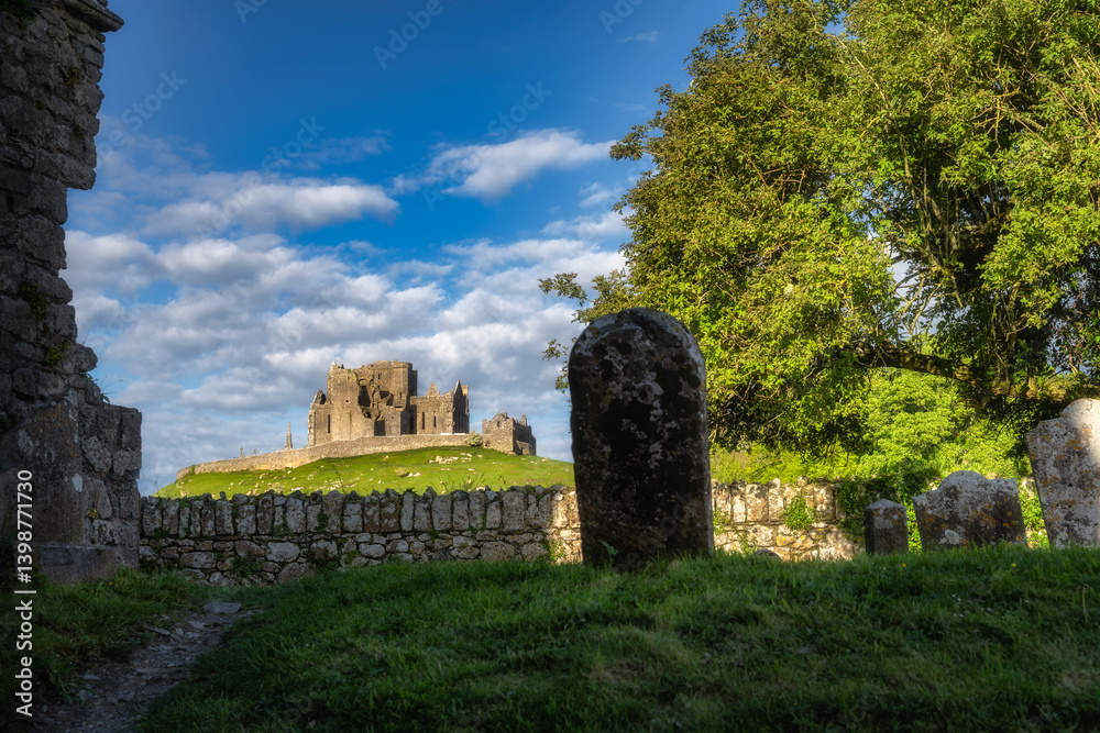 Ancient ruins of Rock of Cashel and Hore Abbey nestled within a vibrant and picturesque landscape, where perfect harmony of history and nature can be witnessed under a colorful sky, Tipperary, Ireland