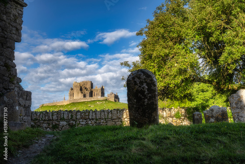 Obraz na płótnie Ancient ruins of Rock of Cashel and Hore Abbey nestled within a vibrant and picturesque landscape, where perfect harmony of history and nature can be witnessed under a colorful sky, Tipperary, Ireland w salonie