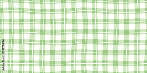 Seamless green plaid pattern with soft wavy lines and checkered grid layout. Classic textile style suitable for spring fabric, wrapping, clothing, wallpaper, or background design. Retro-inspired look.