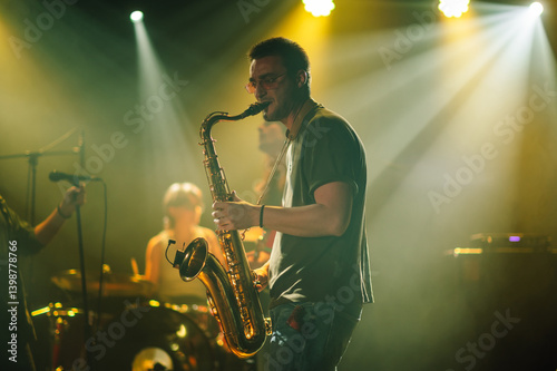 Saxophonist performing live on stage with band