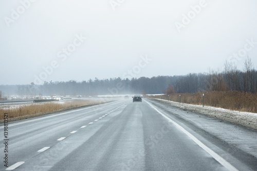 Bad weather on the hightway - wet road in Winter