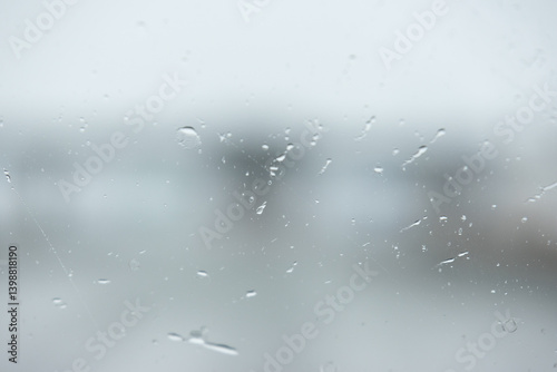 Wet blurry window, water drops - texture, abtract - close up.