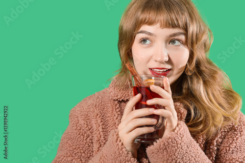 Smiling young woman in tedd...
