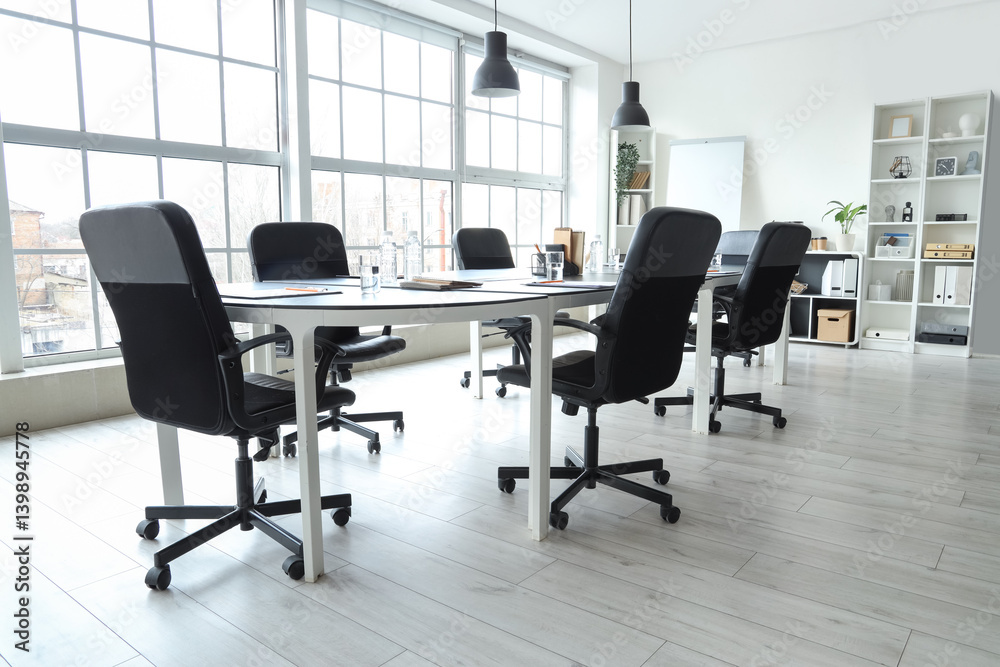 Fototapeta premium Interior of modern office with table prepared for meeting
