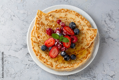 Obraz na płótnie Healthy summer breakfast, homemade classic crepe with fresh fruit and honey w salonie