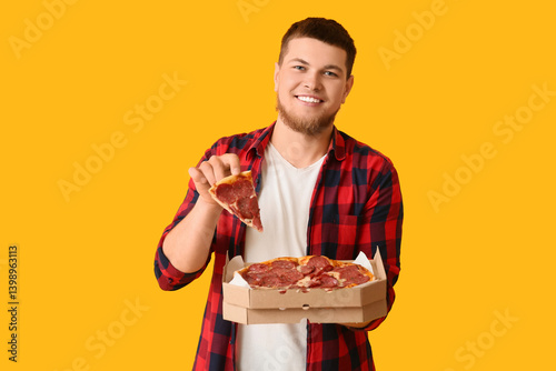 Young man holding cardboard...