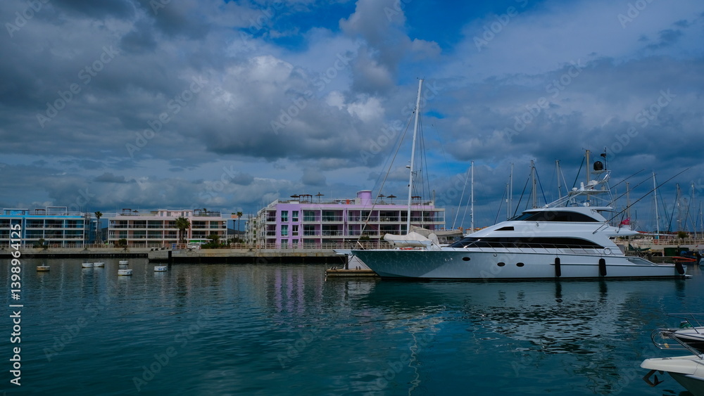 A sleek yacht awaits its next adventure in the marina... A sleek yacht awaits its next adventure in the marina...