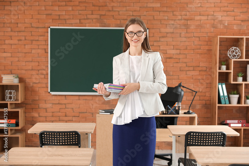 Female teacher with copyboo...