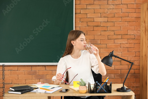 Female teacher drinking wat...
