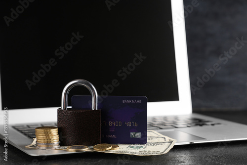 Laptop with padlock, credit...