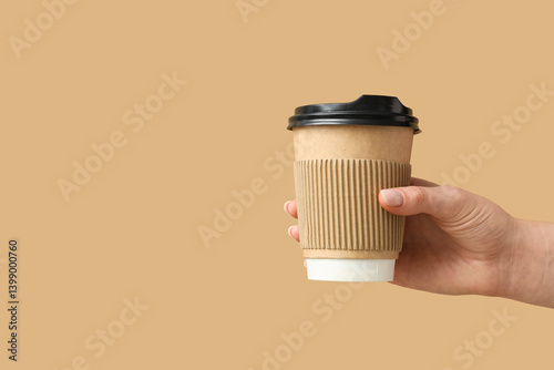 Female hand holding paper c...