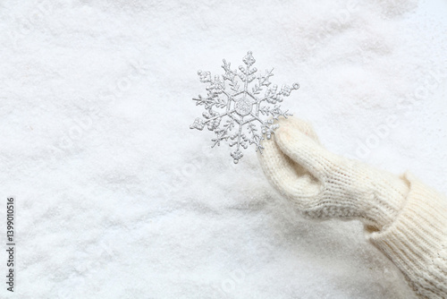Female hand in warm mitten ...