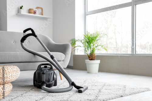 Modern vacuum cleaner near ...