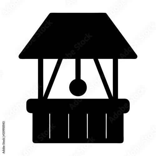 Silhouette of a traditional water well with a protective roof structure
