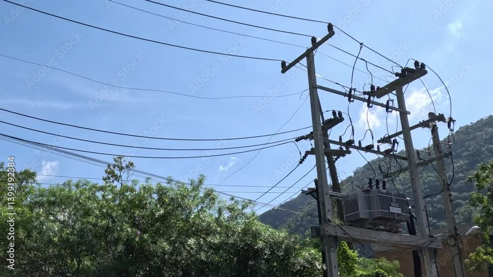 Power Lines Amidst Lush Greenery and Hills Power Lines Amidst Lush Greenery and Hills