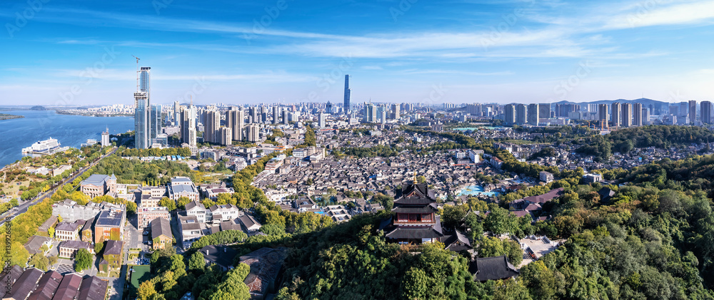 A Stunning Panoramic View of a Modern Urban Skyline with Natural Surroundings