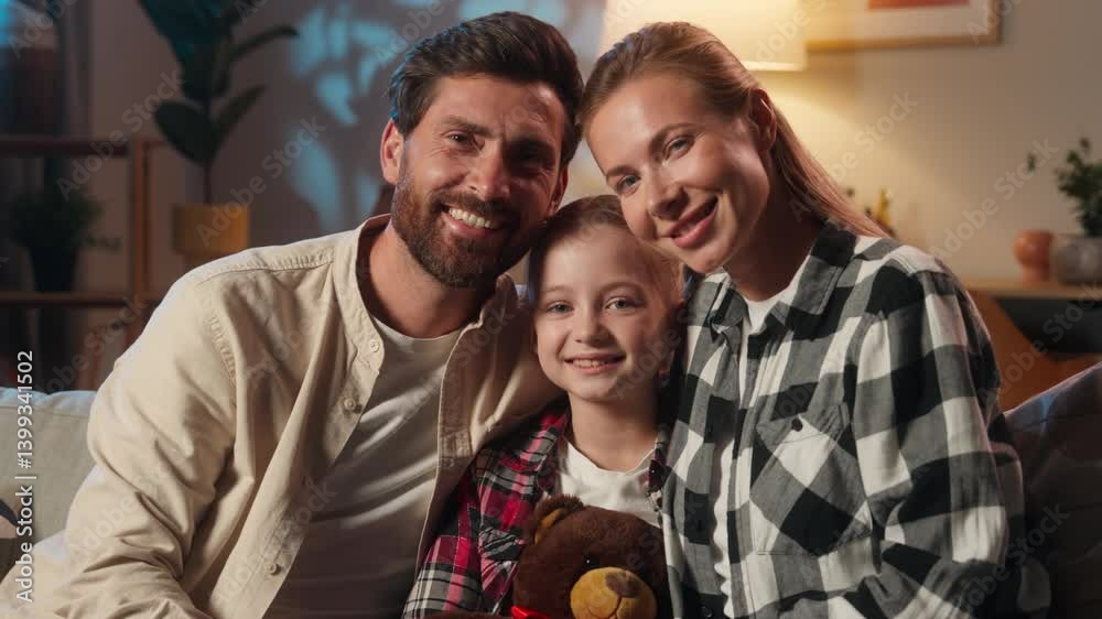 Happy portrait of European family smiling looking at camera satisfied parents with child girl kid daughter custody childcare mother woman with father man at home bank clients insurance house evening