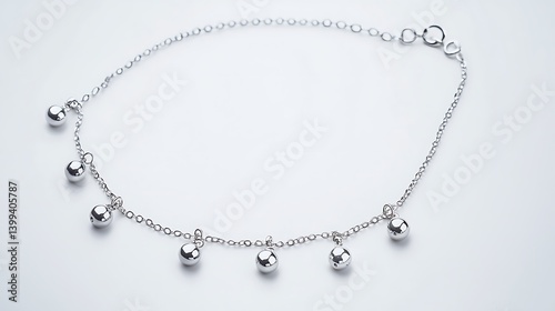 Wallpaper Mural Silver chain necklace with small silver balls hanging from it Torontodigital.ca