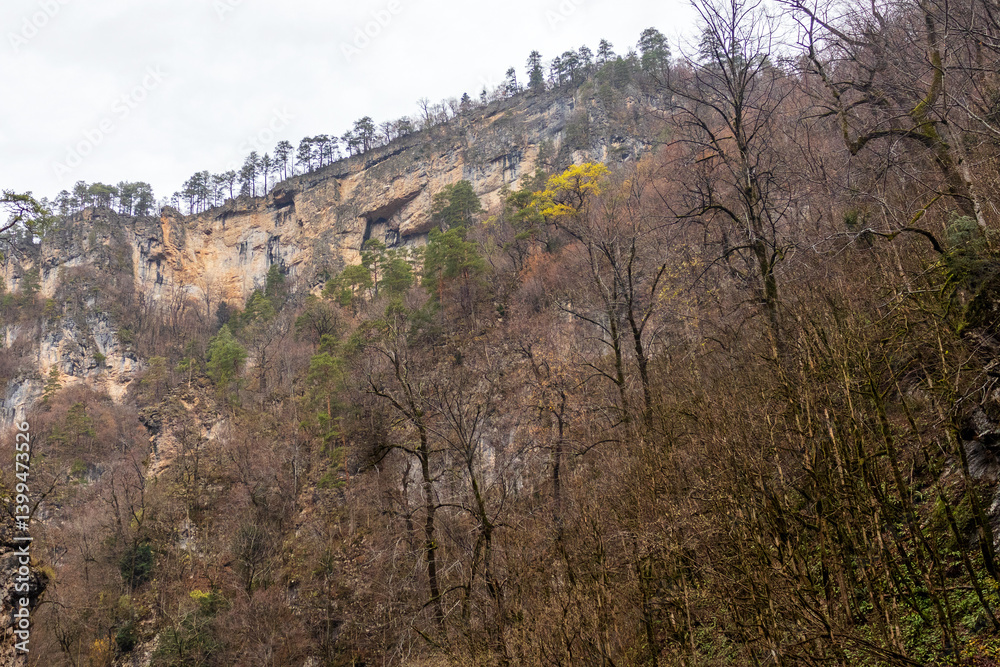 the trail is located along the bottom in the gorge of the mountains, on the way of a tourist route with an overview of the area and the mountain range the trail is located along the bottom in the gorge of the mountains, on the way of a tourist route with an overview of the area and the mountain range