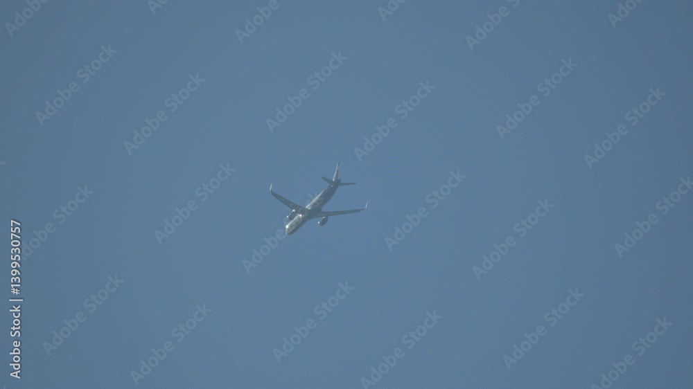 Airplane Flight Sky: High-altitude aircraft daytime flight, likely commercial, showcasing aerial perspective. Airplane Flight Sky: High-altitude aircraft daytime flight, likely commercial, showcasing aerial perspective.