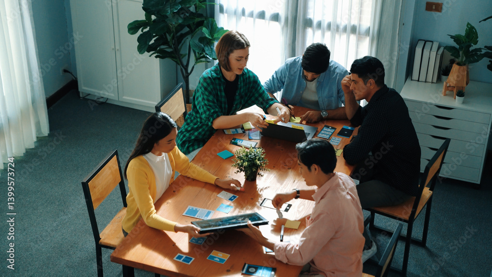 Top view business team discussing about startup project while skilled manager in casual present creative idea and show laptop screen to business people for making decision to investment. Convocation.