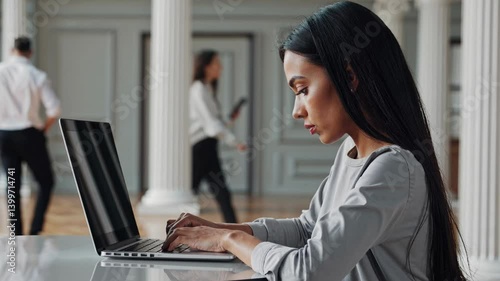 The Woman with Laptop Focused