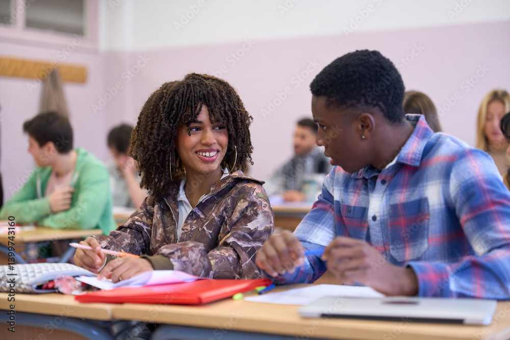 Students interacting during class at university or college institute Students interacting during class at university or college institute