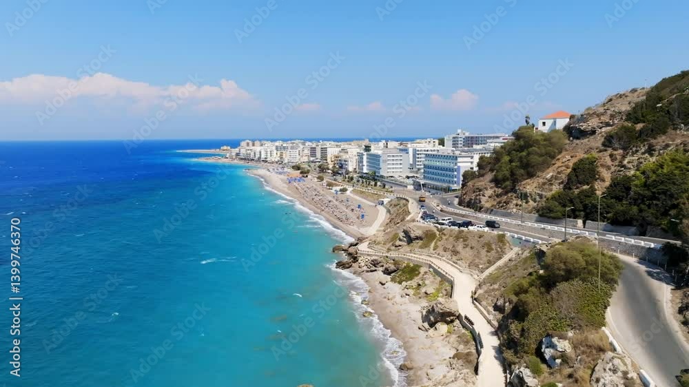 Aerial tracking shot of traffic on the coast of Rhodes city, sunny day in Greece Aerial tracking shot of traffic on the coast of Rhodes city, sunny day in Greece