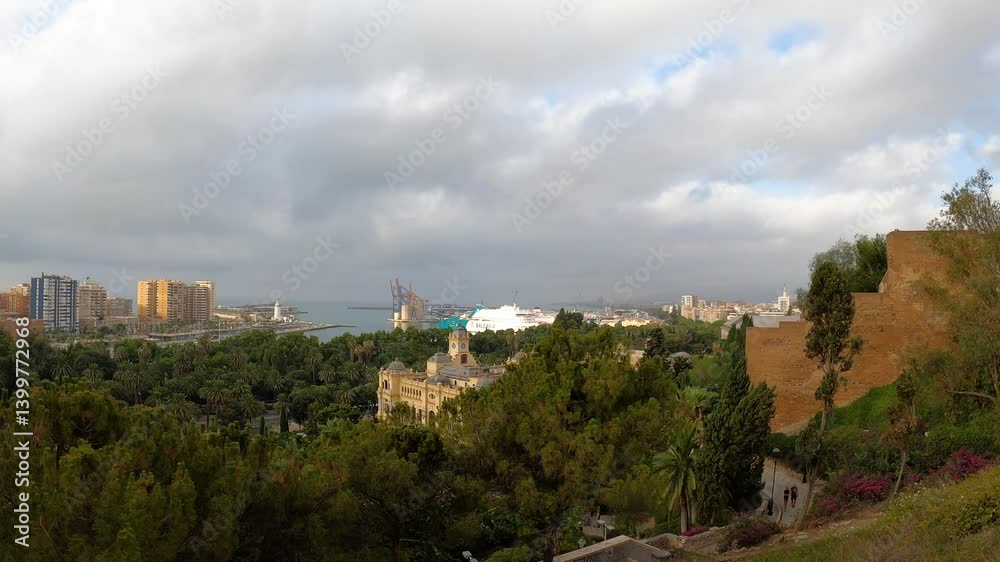 Panoramic aerial view of Malaga in a cloudy summer day in the morning in Malaga, Spain Panoramic aerial view of Malaga in a cloudy summer day in the morning in Malaga, Spain