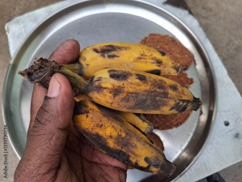 a plat of guava, banana and Thekua. It's commonly offered as prasad during the Chhath Puja festival in Bihar and other regions of India photo