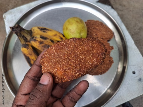 a plat of guava, banana and Thekua. It's commonly offered as prasad during the Chhath Puja festival in Bihar and other regions of India photo