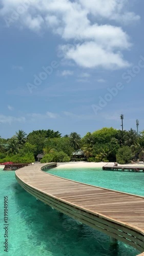 View of Maldivian island from wooden pier. Resort in Indian Ocean. Vertical video