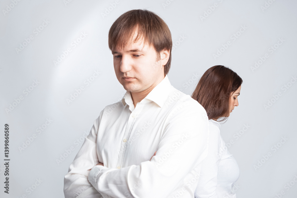 Relationships Concepts. Young Caucasian Couple Trying to Solve Relationships Problems While Standing Together Back to Back With Depressed Feelings. Relationships Concepts. Young Caucasian Couple Trying to Solve Relationships Problems While Standing Together Back to Back With Depressed Feelings.