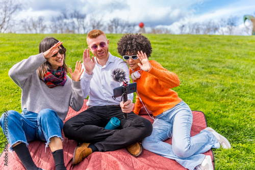 Content creators filming video outdoors in park
