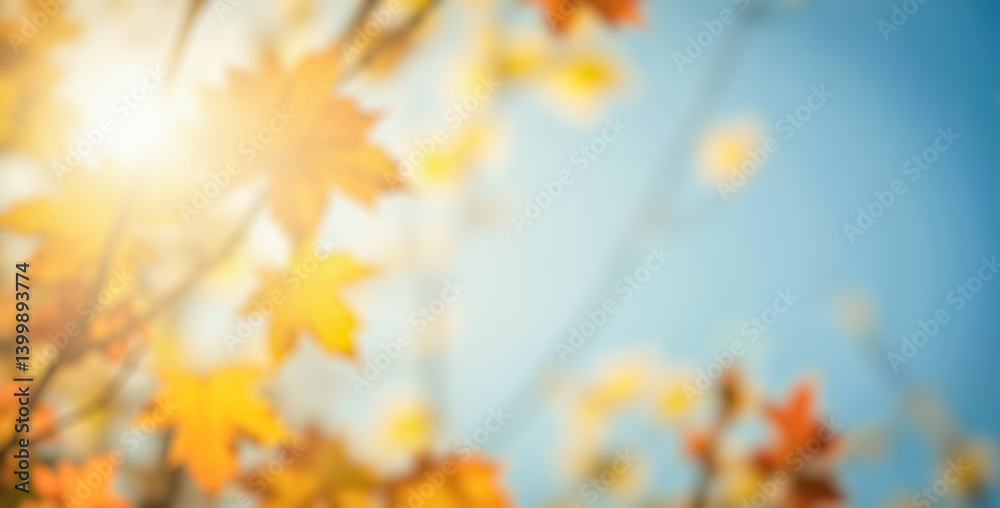Obraz premium Blurry autumn background, vibrant orange leaves, sunny day, soft focus, nature scene, warm sunlight, blue sky, seasonal glow, dreamy atmosphere, outdoor setting