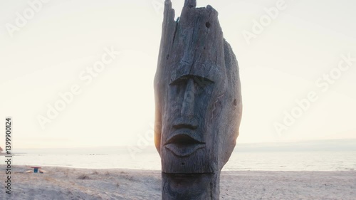 Wallpaper Mural Wooden Totem-Like Figure on a Beach at Golden Hour Torontodigital.ca