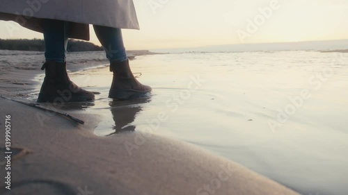 Wallpaper Mural Person Standing on Sandy Beach with Boots in Shallow Water Torontodigital.ca
