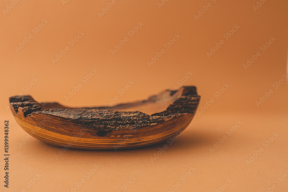 Rustic handmade wooden bowl with natural bark edge on brown background, showcasing organic texture and earthy tones, ideal for eco-friendly or boho-themed decor Rustic handmade wooden bowl with natural bark edge on brown background, showcasing organic texture and earthy tones, ideal for eco-friendly or boho-themed decor