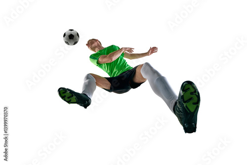 Obraz na płótnie Low angle of male athlete, dressed sport uniform, soccer player jumping for header in motion against white studio background. Concept of professional sport, training, tournament, energy. Ad w salonie