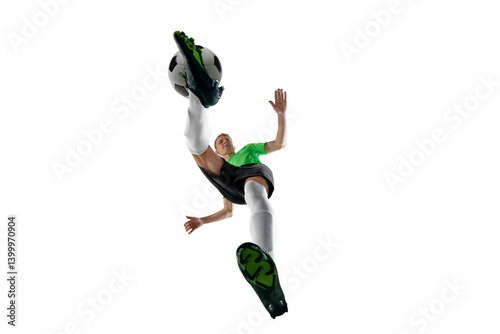 Obraz na płótnie Low angle of energetic man, dressed sport uniform, soccer player sprinting with ball control against white studio background. Concept of professional sport, training, tournament, energy. Ad w salonie