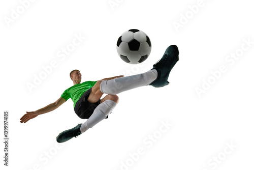 Obraz na płótnie Low angle of focused man, dressed sport uniform, soccer player defending goal with tackle against white studio background. Concept of professional sport, training, tournament, energy. Ad w salonie