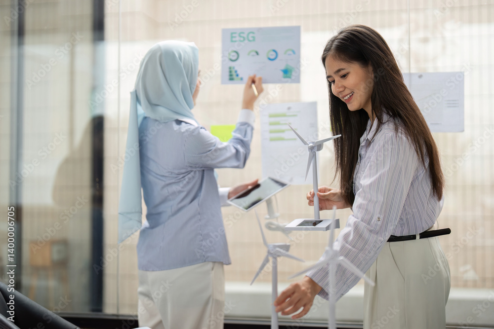 Engagement and Renewable Practices. Team members discussing renewable energy solutions and ESG principles in a corporate setting. Engagement and Renewable Practices. Team members discussing renewable energy solutions and ESG principles in a corporate setting.
